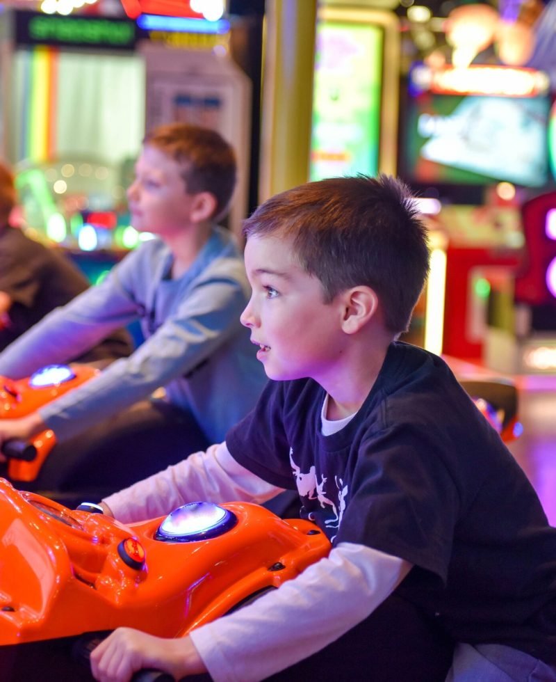 young-boy-and-his-friends-playing-a-motorcycle-rac-2024-12-01-22-55-44-utc